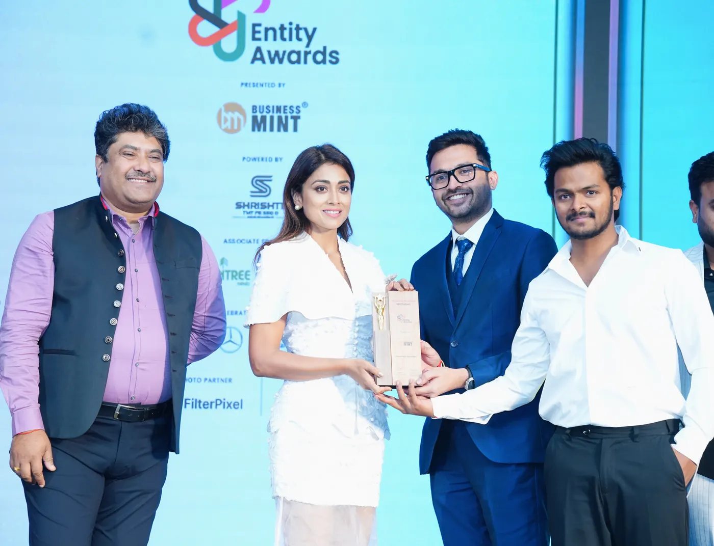 The Modcon team receiving the Outlook Business Spotlight Entity Award 2024 from Business Mint